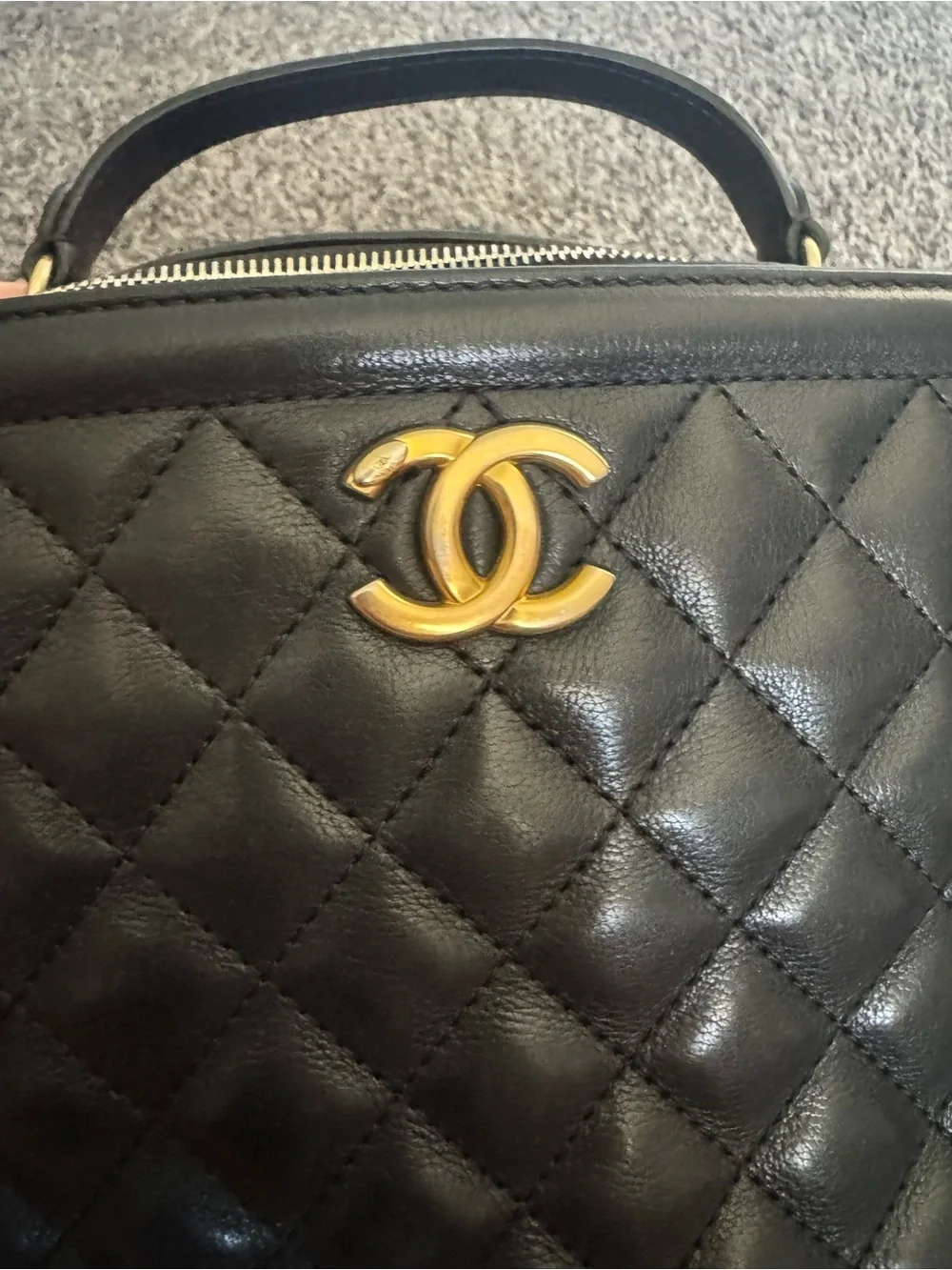 CHANEL Calfskin Quilted CC Vanity Case in black with gold hardware